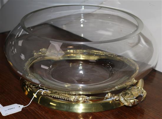 A large glass bowl, mounted with a brass rim cast with crustacea